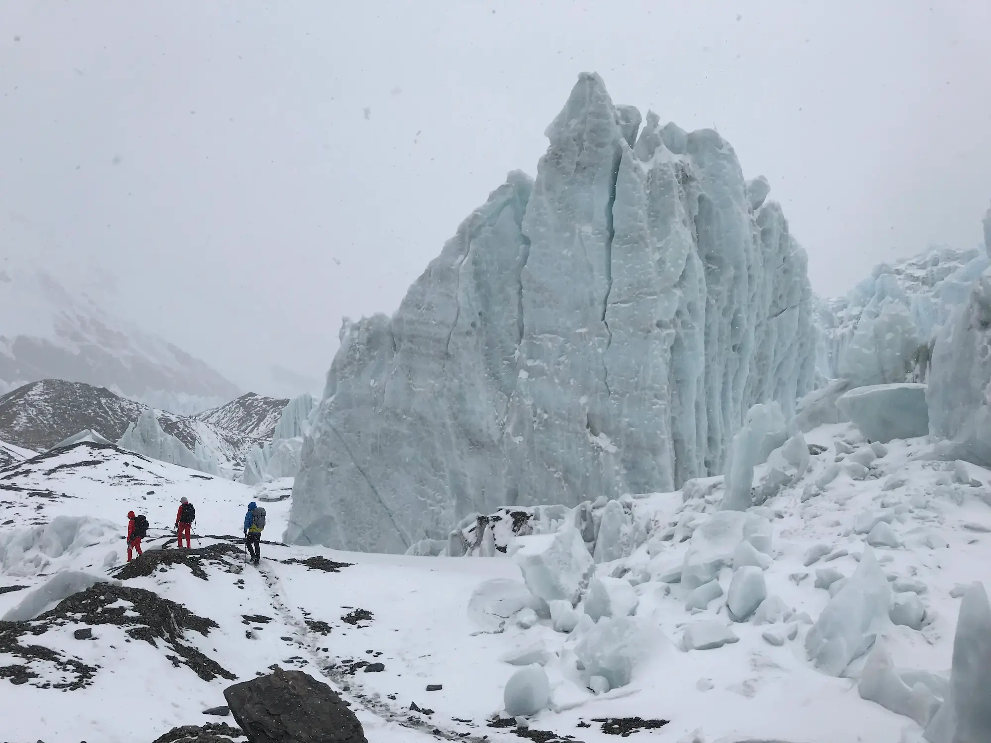 climbers walking in khumjungar peak in mustang