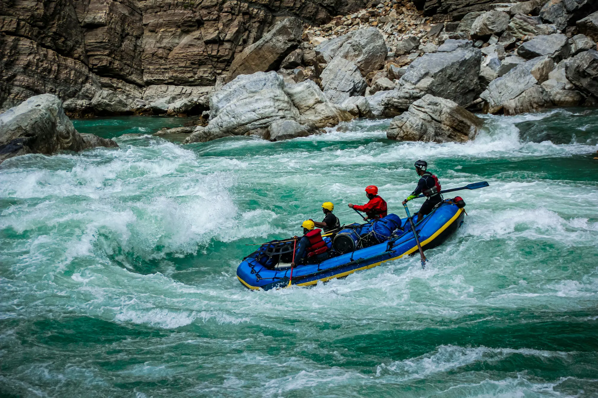 White water rafting adventure on the Karnali River surrounded by remote Himalayan landscapes