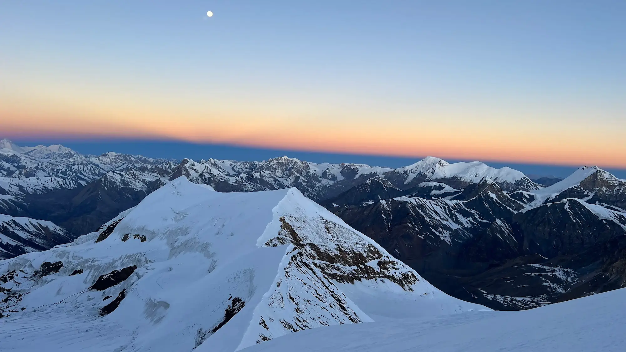 Snow-covered 7000m peak in the Nepal Himalayas during a high-altitude climbing expedition
